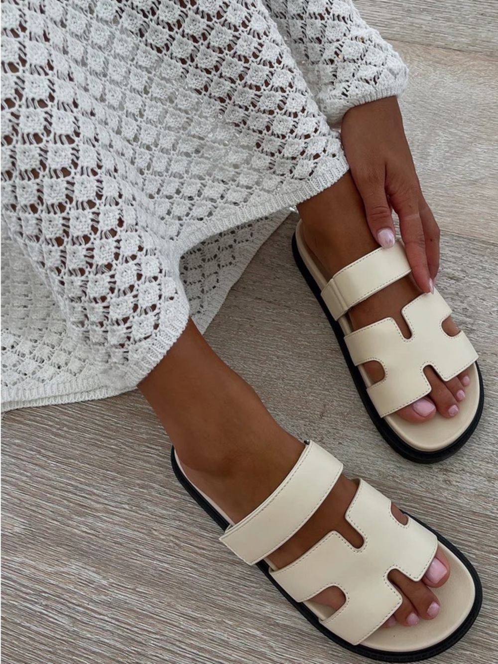 White fox cream and black slide on sandals